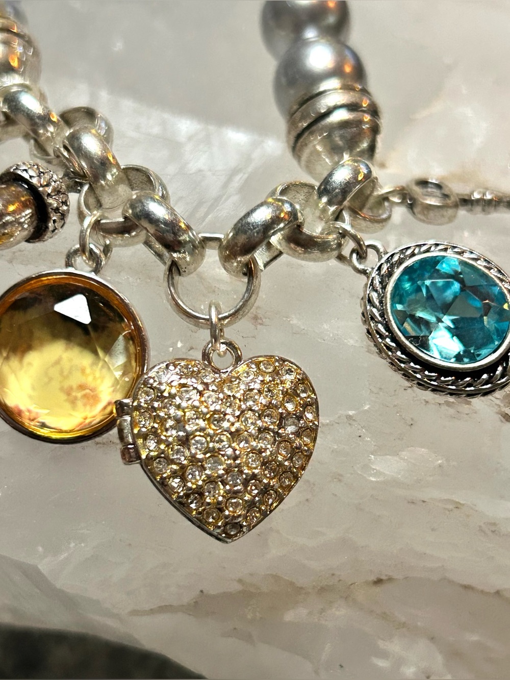 Avon Silver Charm Bracelet with Yellow, Teal Gems with heart locket